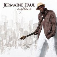 Jermaine paul holding a guitar 