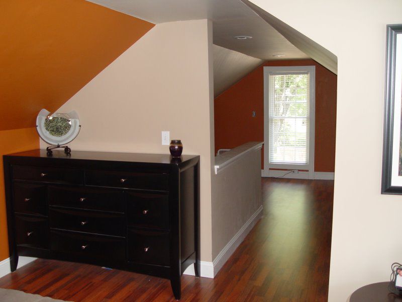 Finshed attic space with new dormer and master suite after fire damage to upper level