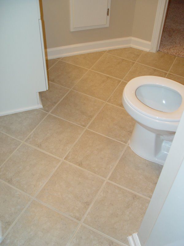 New basement bathroom with new tile flooring