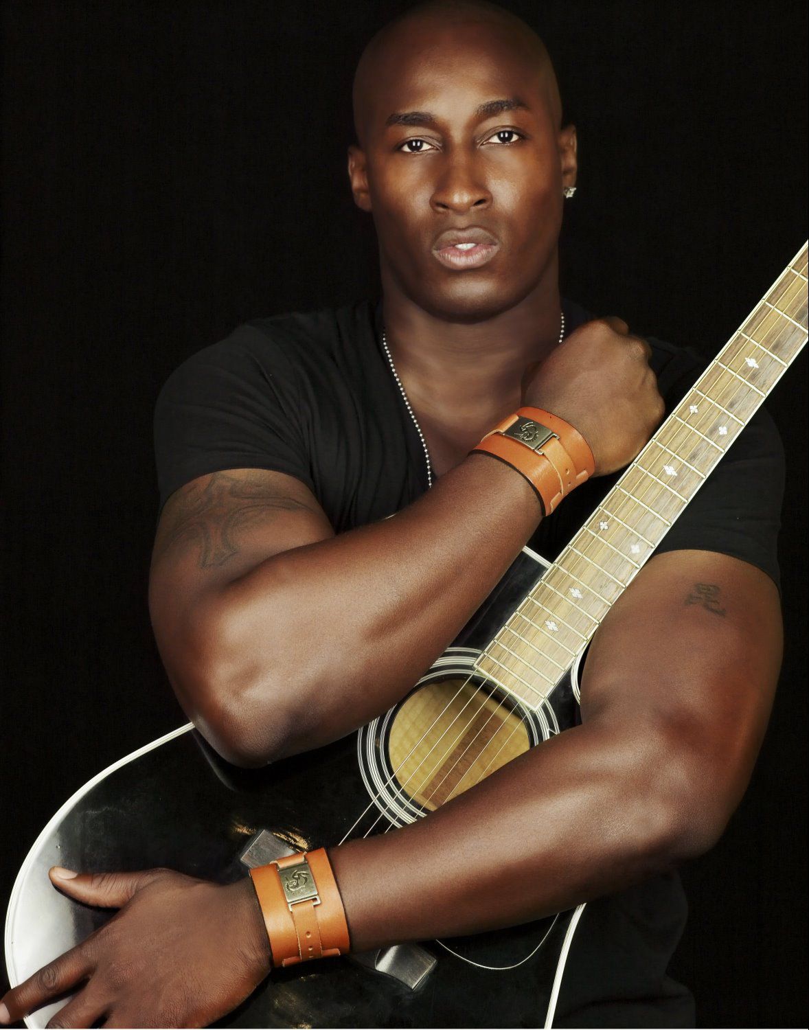 man hugging the guitar 