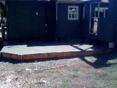 New rear patio with new screened-in porch construction