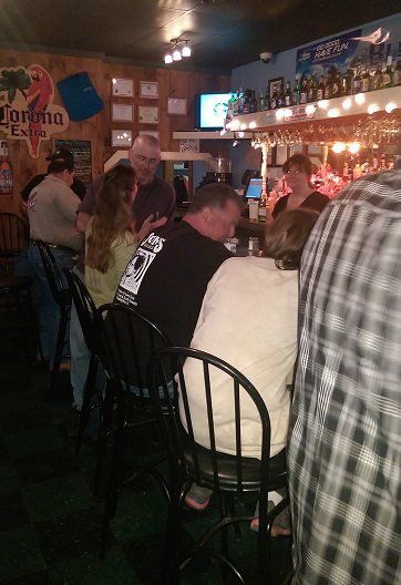 customers sitting at the bar