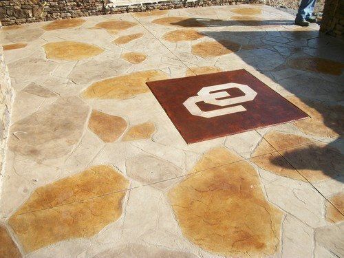 Patio - Stamped & acid stained with custom logo