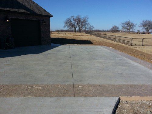 Driveway - Broom finish concrete with stamped border (Old Granite pattern).jpg