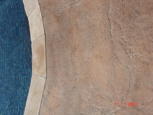 Stamped Concrete - Pool Decks - Old Granite with Flagstone Coping.